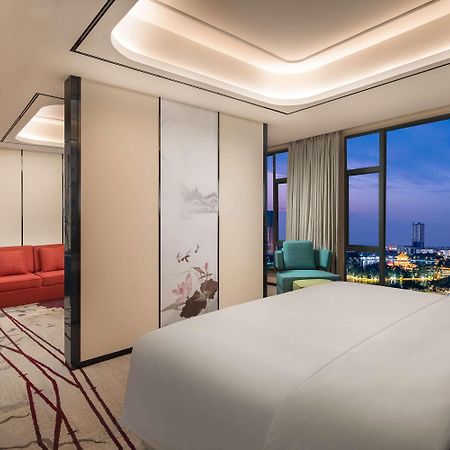 Ramada By Wyndham Mengzi Suites Exterior photo