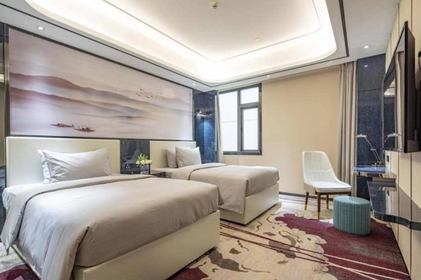 Ramada By Wyndham Mengzi Suites Exterior photo